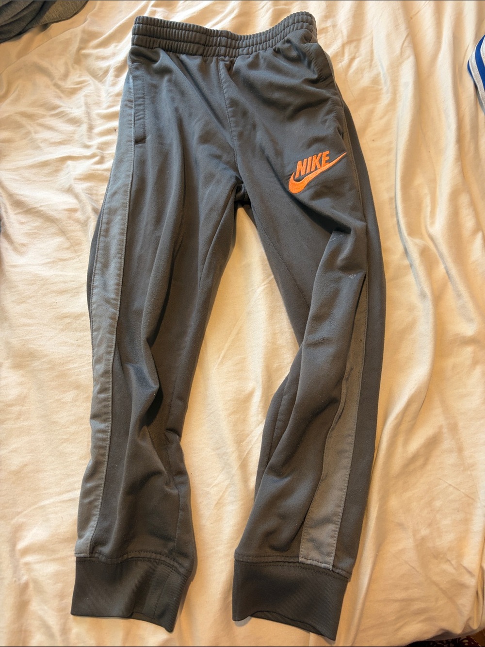 Nike Kids Gray Joggers with Orange Swoosh